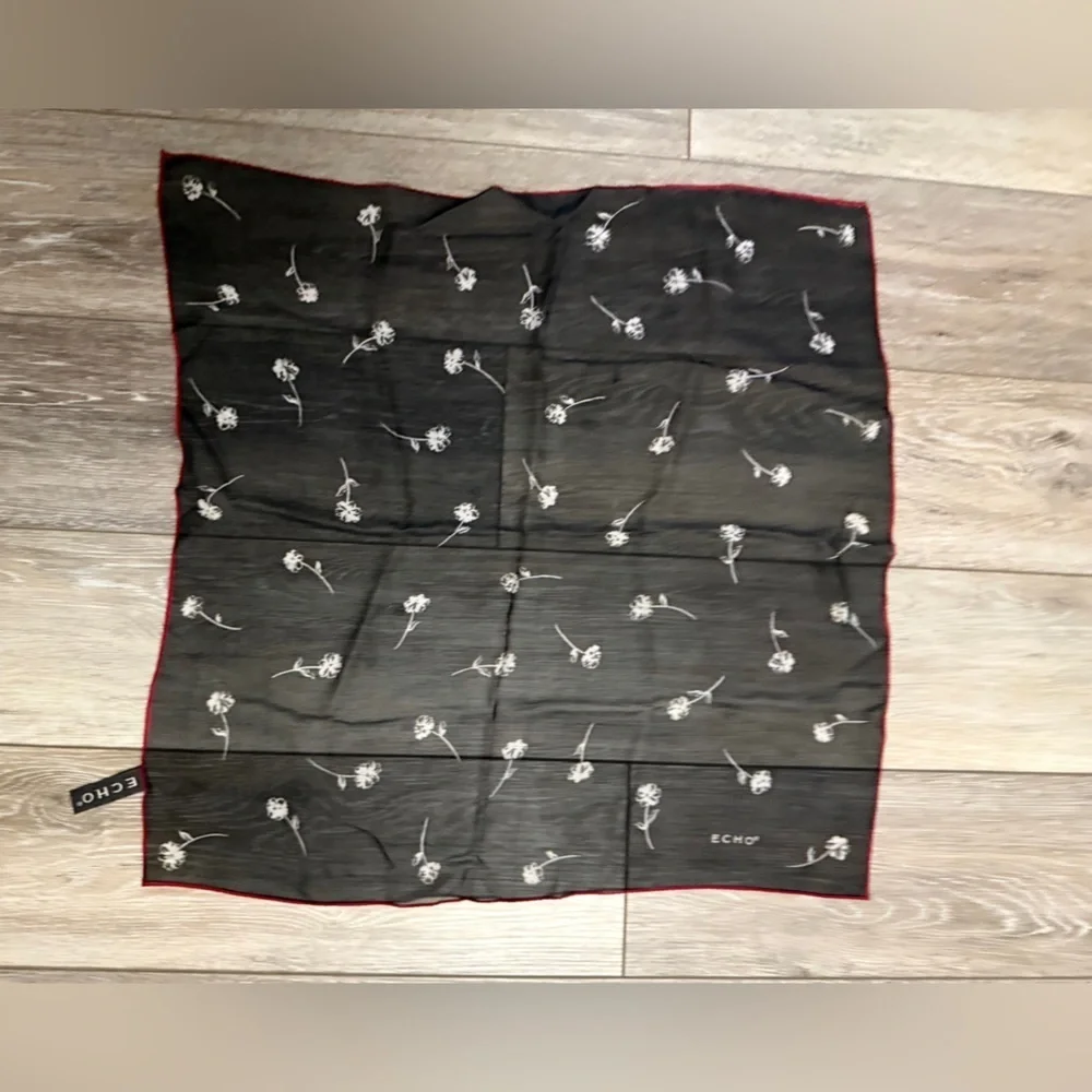 ECHO Small Black Sheer and stretch Scarf with white floral and red outline.